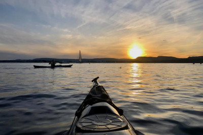 Kajakktur i solnedgag. Foto: Oslo Kayak Tours.